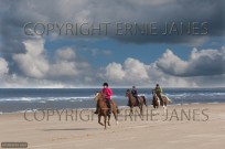 Horse Riding on Holkham Beach Norfolk (EAJ008998)