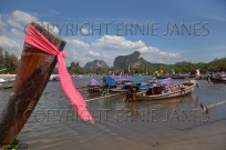 Long tailed boats and limestone karsts Krabi Thail (EAJ009151)