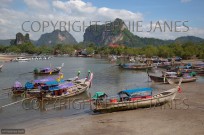 Long tailed boats and limestone karsts Krabi Thail (EAJ009152)